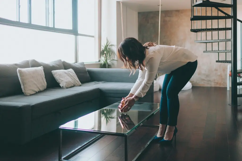 a-woman-staging-a-beautiful-modern-apartment